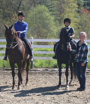 two girls in their riding lesson